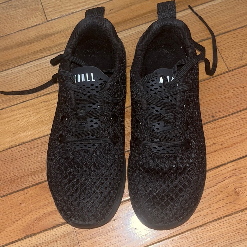 NOBULL black sneakers.